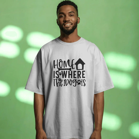Man wearing a white t-shirt with 'Home is where the dog is' text on a green background