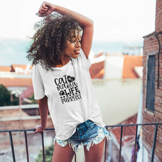 Young girl wearing a white t-shirt with text on a rooftop