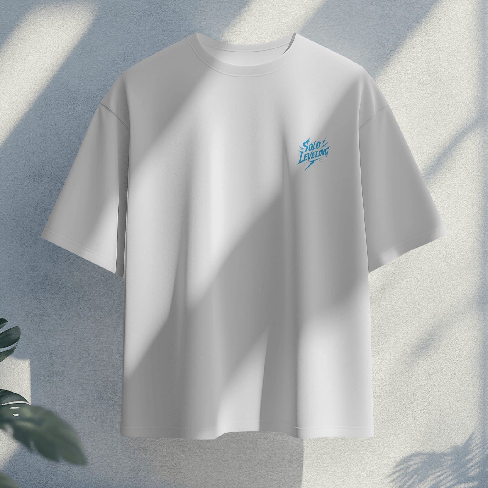 White t-shirt with a small blue logo on a light gray background